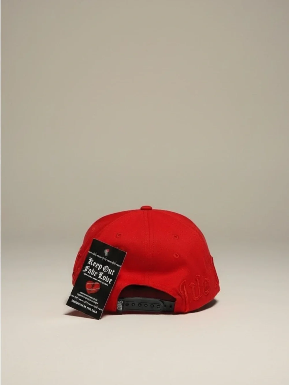 Out of fake love Hat with red black trim